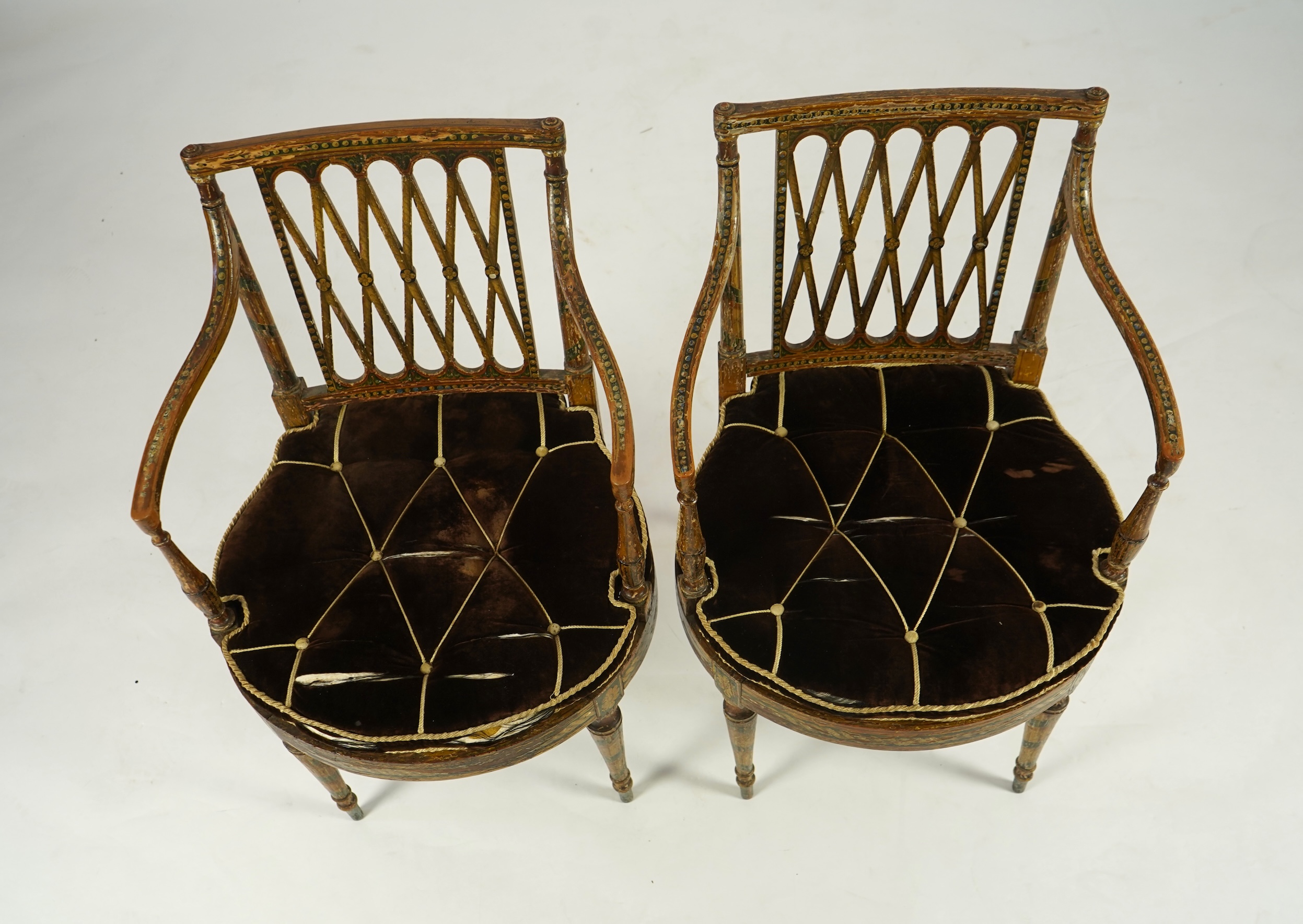 A set of six Sheraton period painted decorated cane seat elbow chairs